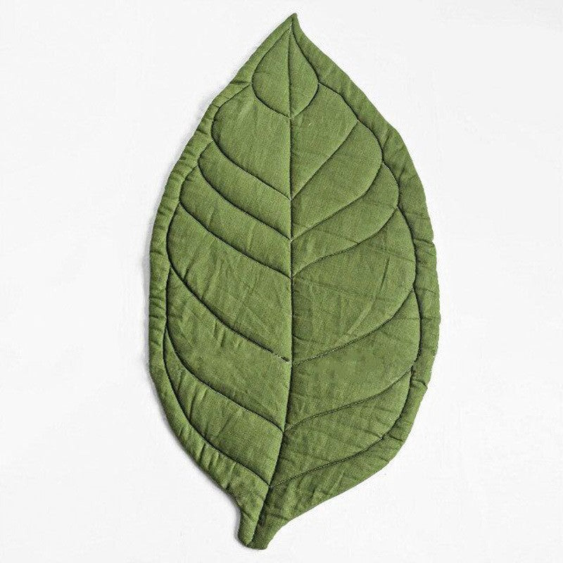 http://coalahola.com/cdn/shop/files/coalahola-leaf-shaped-baby-play-mat-green.jpg?v=1689836763